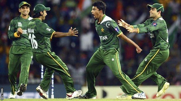 Pakistan celebrate taking a wicket against India