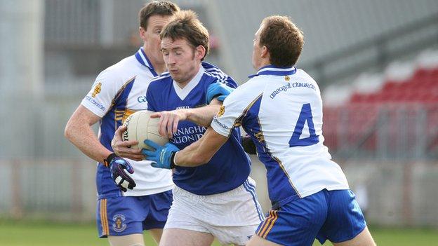 Dromore's Sean McDonnell is tackled by Ciaran Quinn