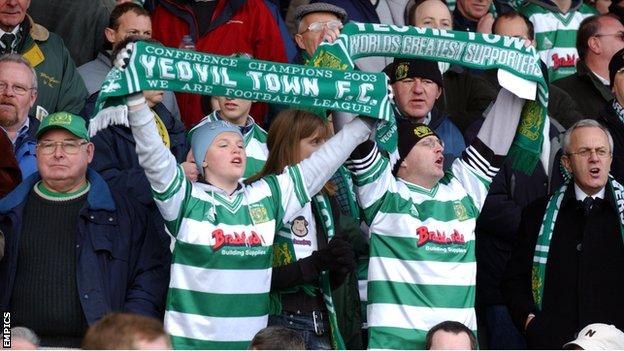 Fans cheer on Yeovil Town during their FA Cup match with Liverpool in 2004