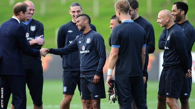 The Duke of Cambridge shakes Ashley Cole's hand