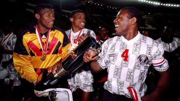 Peter Rufai (left) celebrates with the Nations Cup trophy in 1996