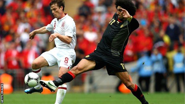 Scott Parker (left) tussles with Belgium's Marouane Fellaini