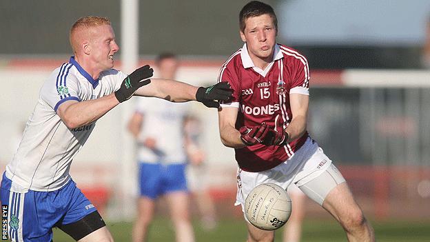 Ballinderry's Conor Nevin moves in to challenge Sé McGuigan of Slaughtneil