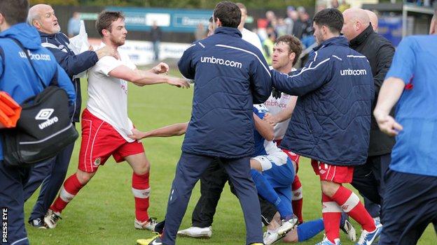 Linfield and Dungannon players clash after a 1-1 draw at Stangmore Park