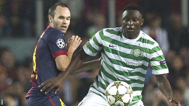 Andres Iniesta of Barcelona is challenged by Wanyama in Spain