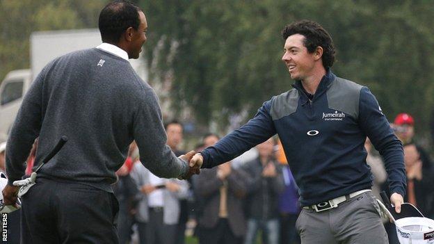 Tiger Woods (left) congratulates Rory McIlroy on his one-stroke victory