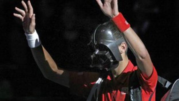 Novak Djokovic arrives on court wearing a Darth Vader mask