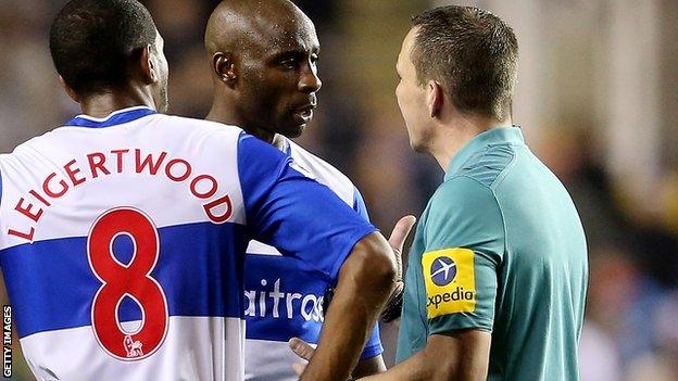 Jason Roberts of Reading talks to referee Kevin Friend during the Capital One Cup Fourth Round match between Reading and Arsenal