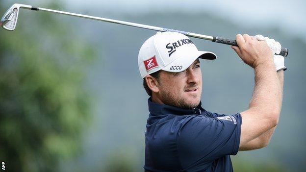 Graeme McDowell tees off during the first round in Shenzhen