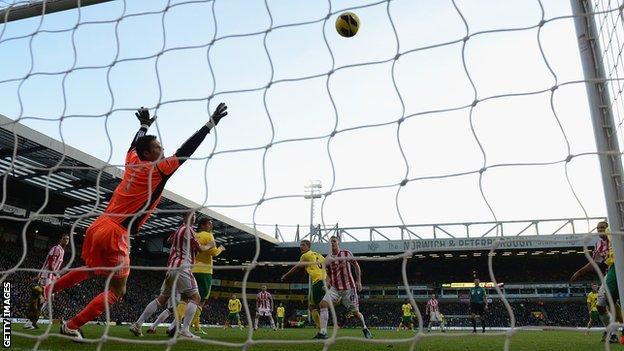 Stoke goalkeeper Asmir Begovic cannot keep out Bradley Johnson's first-half header