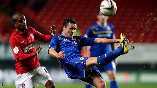 Cardiff City's Don Cowie (right) clears the ball under pressure from Charlton Athletic's Bradley Pritchard