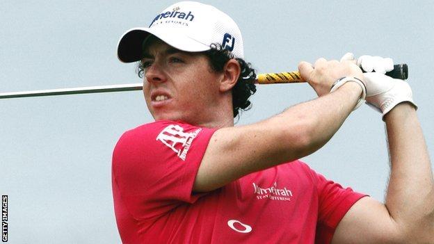 McIlroy follows his second shot at the fifth hole
