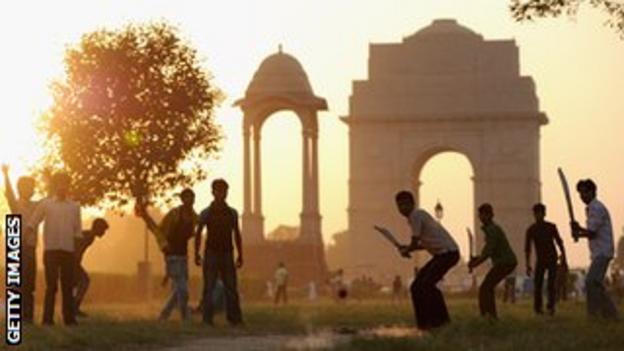 Children play cricket in India