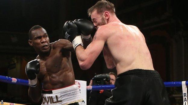 Ovill McKenzie lands a solid left on Enzo Maccarinelli