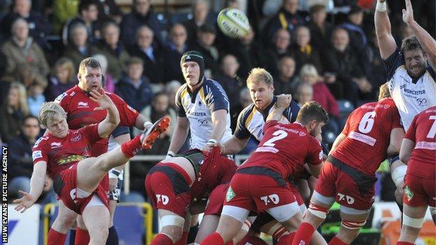 Scrum-half Aled Davies clears for Scarlets