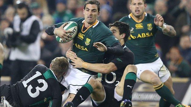 South Africa's Ruan Pienaar is tackled by Keith Earls and Conor Murray of Ireland