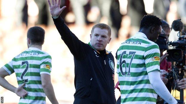 Neil Lennon salutes the visiting fans at Pittodrie