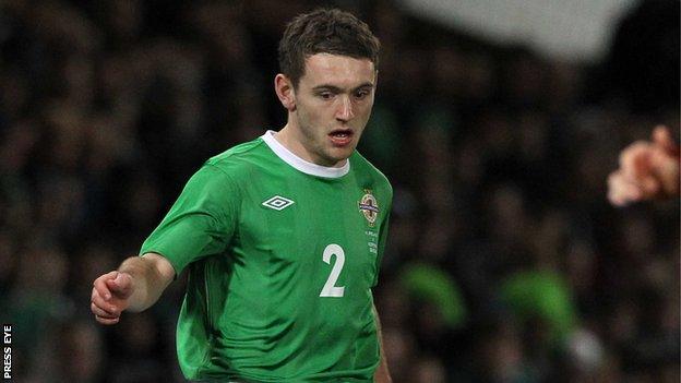 Northern Ireland defender Lee Hodson has joined Brentford on loan