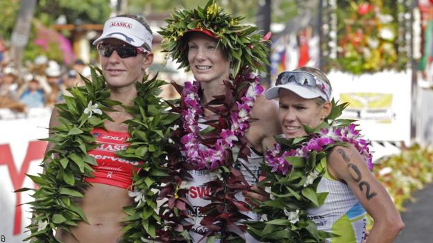 Leanda Cave, covered in traditional Hawaiian garlands, tops off a fine 2012 by adding the Ironman World Championship title to the Half-Ironman World Championship victory she claimed earlier in the year