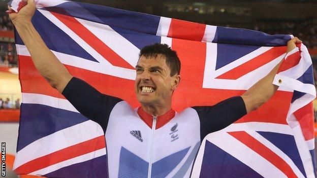 Mark Colbourne celebrates after winning a track C1 3km Individual Pursuit gold medal at the 2012 Paralympic Games