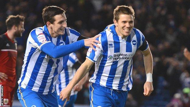 Dean Hammond of Brighton (right) celebrates with team mate Lewis Dunk after opening the scoring