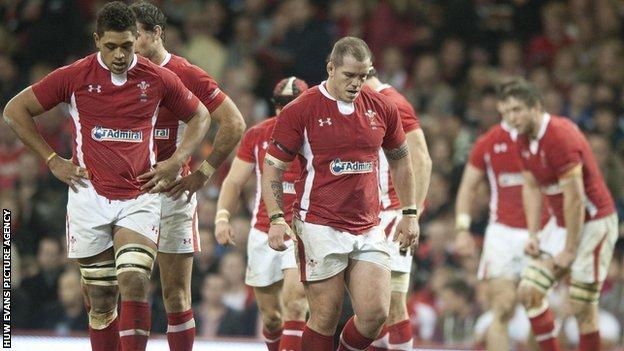 Wales players trudge off the field after defeat to New Zealand
