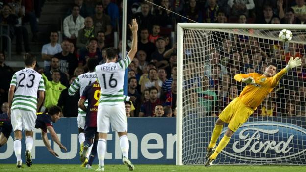 Celtic keeper Fraser Forster (right) makes a great save