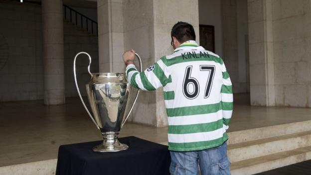 A Celtic fan with the European Cup won by the club in 1967