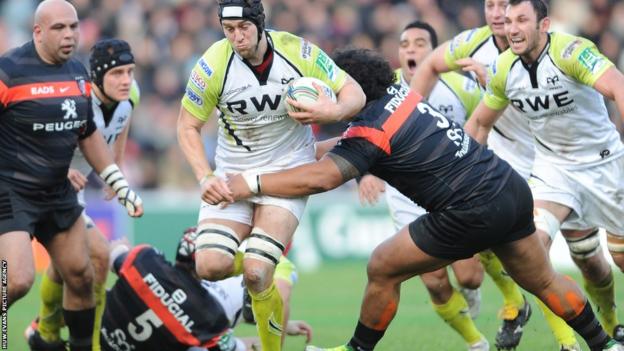 Ryan Jones runs into strong Toulouse defence as the Ospreys are beaten 30-14 in Pool 2 of the Heineken Cup