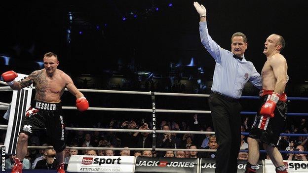 Mikkel Kessler starts celebrating after the fight against Brian Magee is stopped
