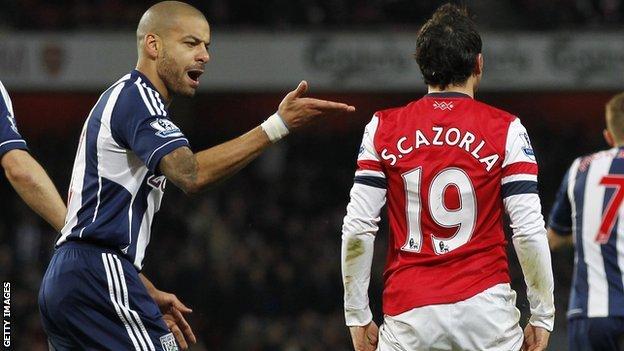 West Brom right-back Steven Reid (left) says he did not make contact with Arsenal's Santi Cazorla