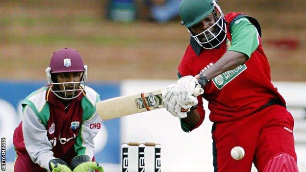 West Indies' Denesh Ramdin and Zimbabwe's Hamilton Masakadza