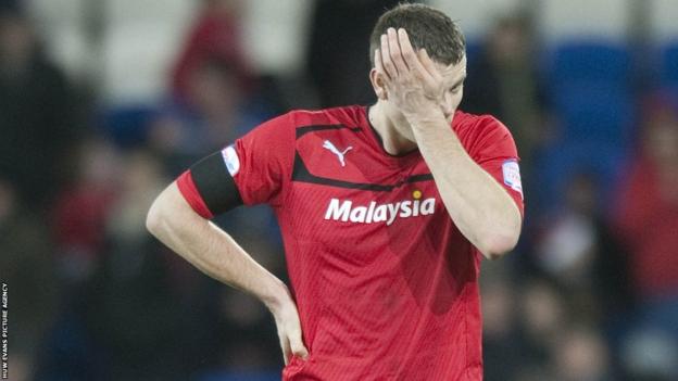 Ben Turner reacts after the final whistle as Peterborough win 2-1 to end Cardiff's 100% home record this season