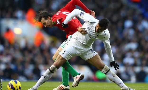 Swansea City striker Michu battles for the ball with Tottenham midfielder Sandro during the Premier League game at White Hart Lane.