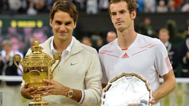 Wimbledon men's singles winner Roger Federer and runner-up Andy Murray pose with their trophies