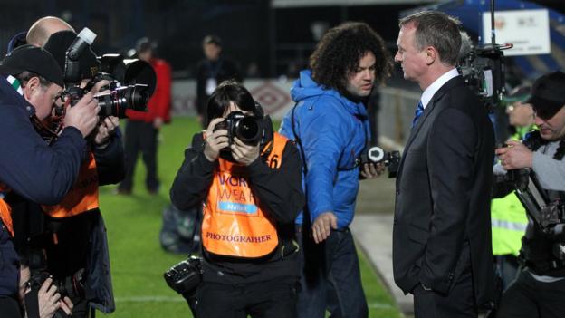 Photographers scramble to get the shot as O'Neill takes charge of Northern Ireland for the first time at Windsor Park