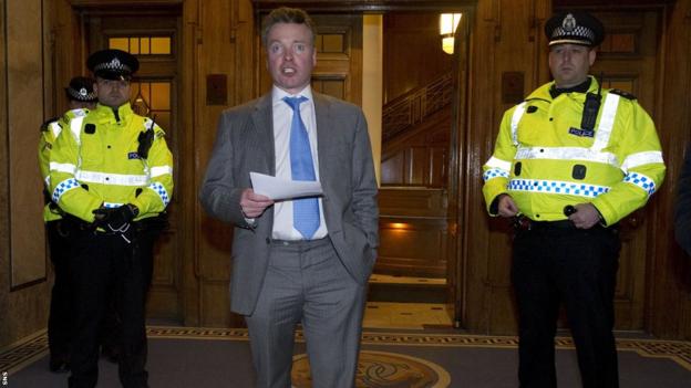 Rangers owner Craig Whyte announces to fans gathered at the main entrance to Ibrox Stadium that the club is likely to go into administration