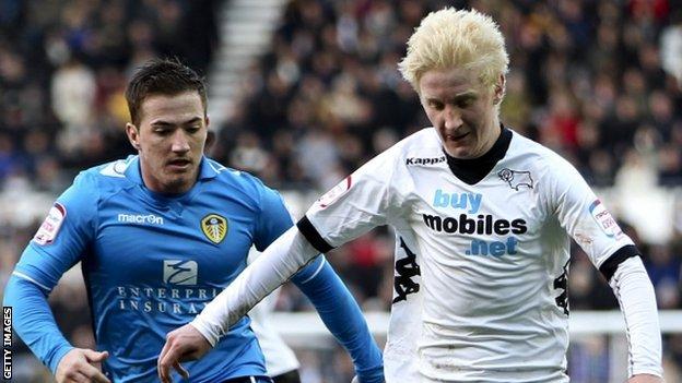Will Hughes (right) holds off Ross McCormack of Leeds