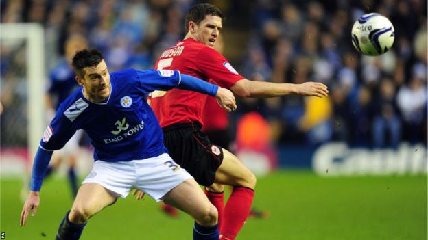 Leicester City's David Nugent (left) and Cardiff City's Mark Hudson battle for the ball