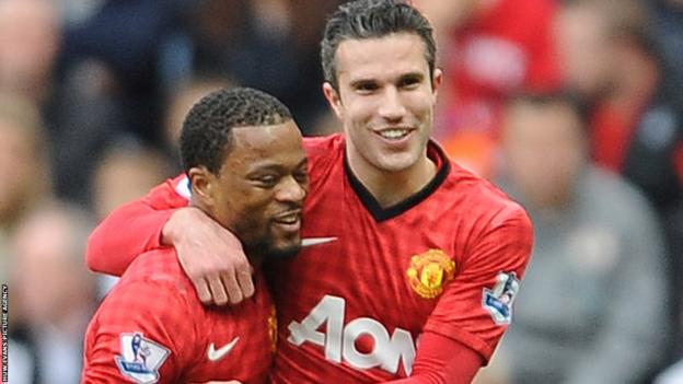 At the Liberty Stadium, Patrice Evra is congratulated by Robin van Persie after giving Manchester United a 16th minute lead against Swansea City.
