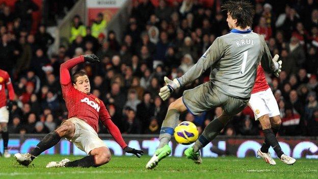 Manchester United's Javier Hernandez beats Newcastle goalkeeper Tim Krul