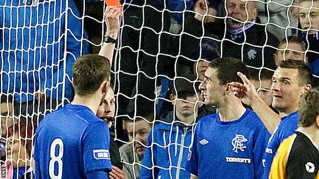 Lee Wallace (centre) is shown the red card against Annan