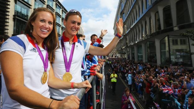 Rowers Helen Glover (left )and Heather Stanning take part in the London 2012 Victory Parade for Team GB and Paralympics GB athletes