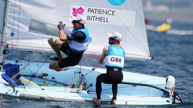 Luke Patience (right), from Aberdeen, and Stuart Bithell celebrate winning the silver medal in the men's 470 sailing on day 14 of the Games at Weymouth