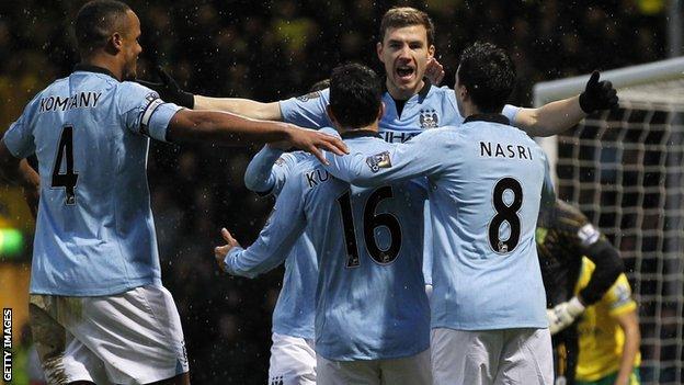 Manchester City celebrate Edin Dzeko (second right) scoring at Norwich