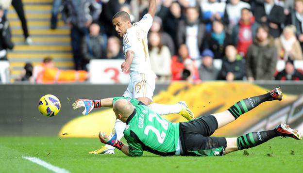Wayne Routledge steers the ball past Brad Guzan to give Swansea City the lead again Aston Villa at the Liberty Stadium.