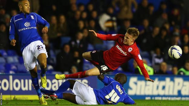 Morgaro Gomis of Birmingham tackles Craig Noone