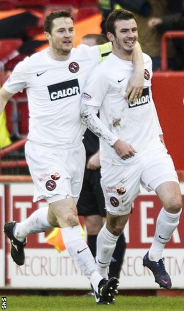 Jon Daly and Gavin Gunning celebrate for United at Pittodrie