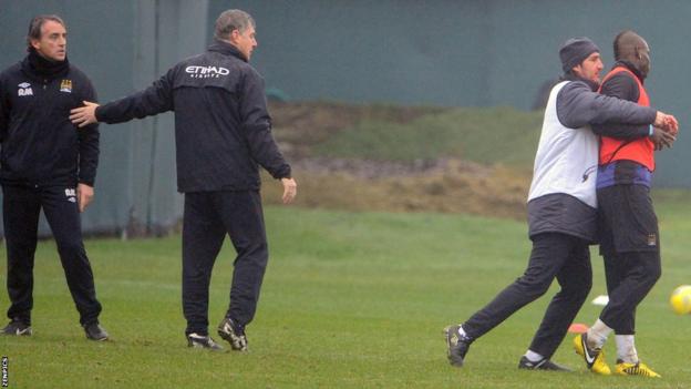 Roberto Mancini (second left) and Mario Balotelli (far right)