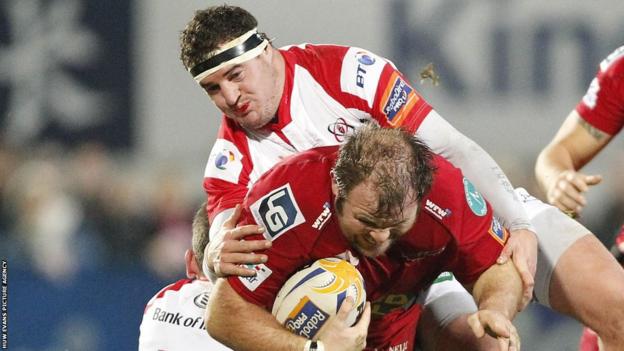 Jacobie Adriaanse is tackled as the Scarlets take on Ulster in the Pro12